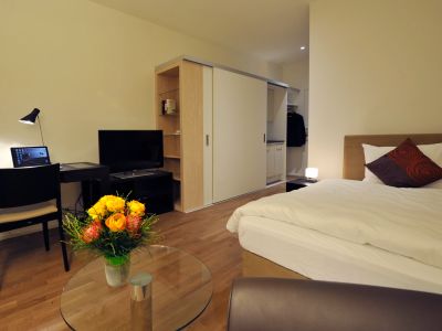 Smart apartment with working desk, bed, cabinet and kitchenett